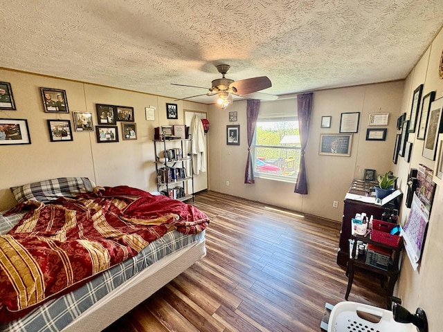 980 Persimmon Ridge Rd, Carlisle, KY 40311 - bedroom with a textured ceiling, ceiling fan, and wood finished floors