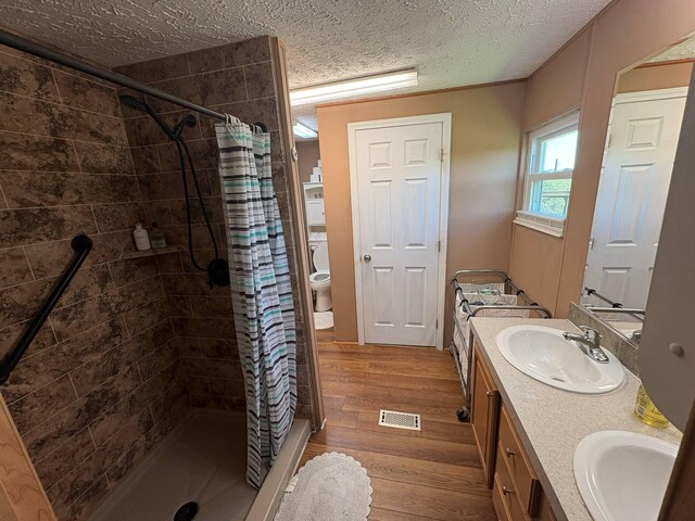 980 Persimmon Ridge Rd, Carlisle, KY 40311 - full bathroom featuring visible vents, a sink, wood finished floors, and a shower stall