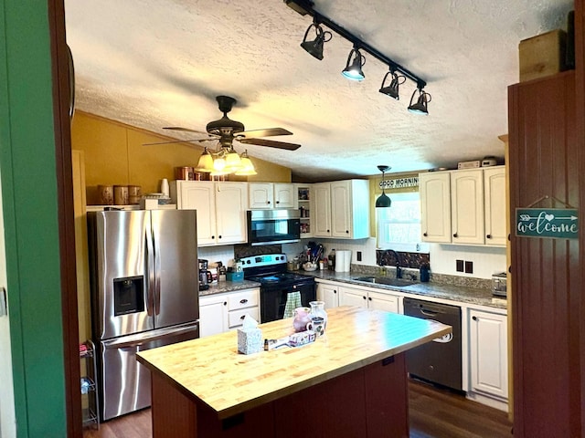 980 Persimmon Ridge Rd, Carlisle, KY 40311 - kitchen with a sink, a textured ceiling, butcher block countertops, a center island, and stainless steel appliances