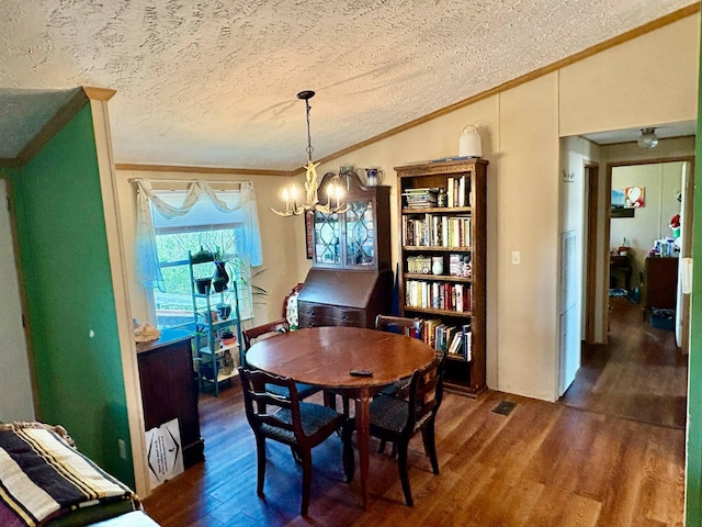 980 Persimmon Ridge Rd, Carlisle, KY 40311 - dining area with an inviting chandelier, ornamental molding, dark wood-style flooring, and a textured ceiling