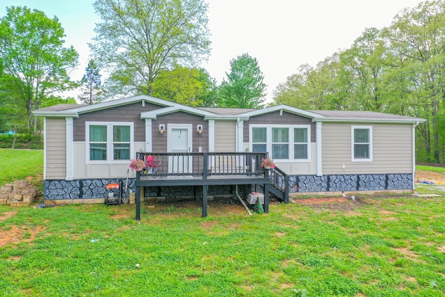 6989 W Laurel Rd, London, KY 40741 - manufactured / mobile home with a front lawn and a deck