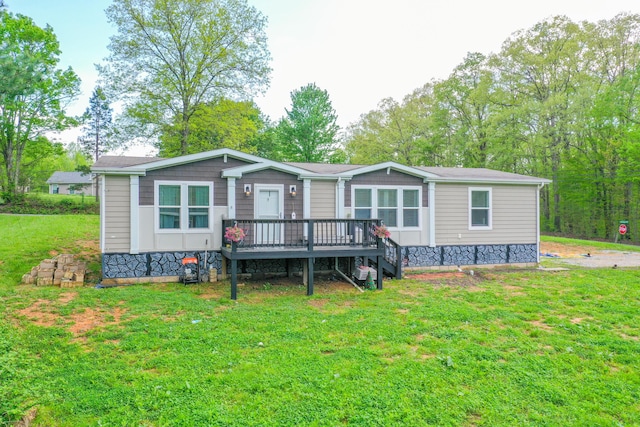 6989 W Laurel Rd, London, KY 40741 - view of front facade featuring a front yard and a wooden deck