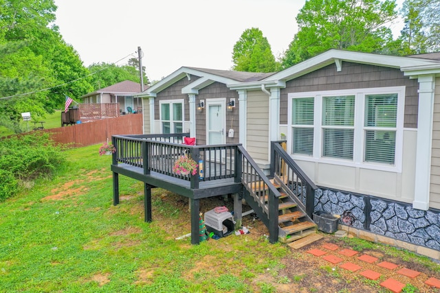 6989 W Laurel Rd, London, KY 40741 - back of house with a lawn, a wooden deck, and fence