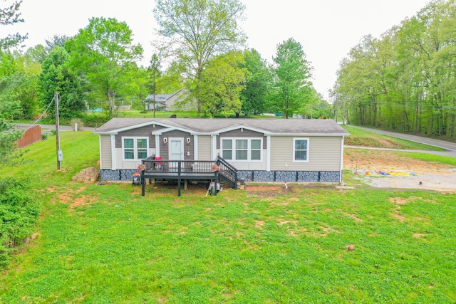 6989 W Laurel Rd, London, KY 40741 - view of front of house with a wooden deck and a front lawn