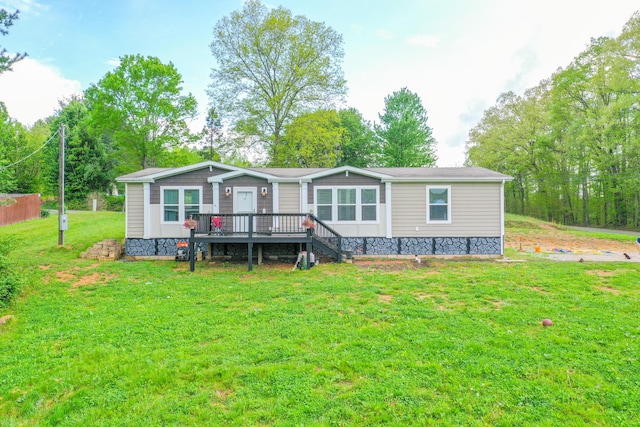 6989 W Laurel Rd, London, KY 40741 - view of front facade with a deck and a front yard