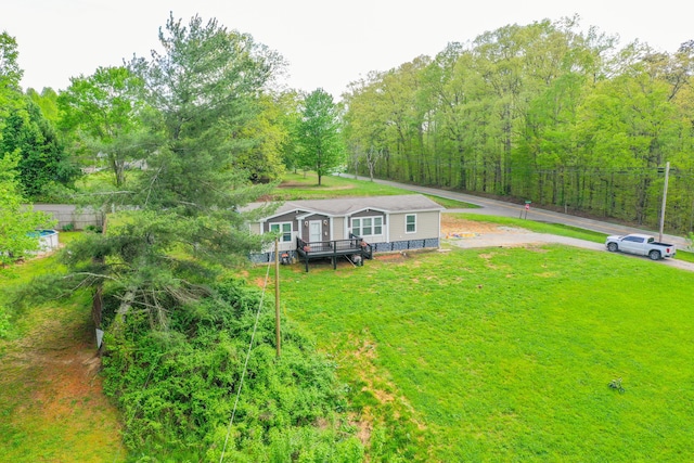 6989 W Laurel Rd, London, KY 40741 - exterior space featuring a lawn and a wooden deck