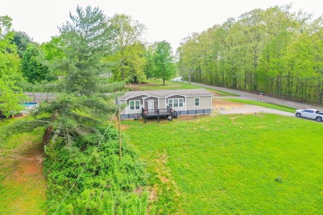 6989 W Laurel Rd, London, KY 40741 - manufactured / mobile home featuring a wooden deck and a front yard