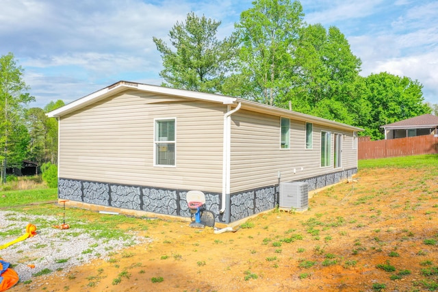6989 W Laurel Rd, London, KY 40741 - view of side of property featuring central AC unit and fence