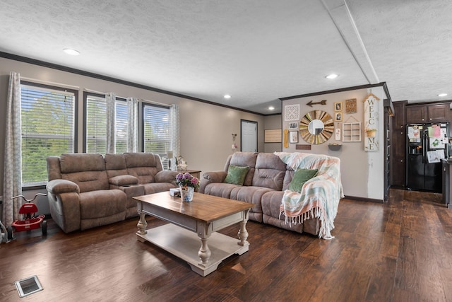 6989 W Laurel Rd, London, KY 40741 - living area with a textured ceiling, visible vents, ornamental molding, and dark wood-type flooring