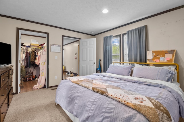 6989 W Laurel Rd, London, KY 40741 - bedroom featuring recessed lighting, a textured ceiling, ornamental molding, a walk in closet, and light colored carpet