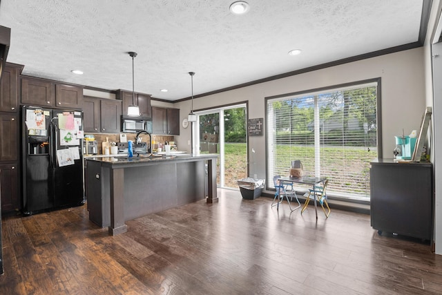 6989 W Laurel Rd, London, KY 40741 - kitchen featuring a textured ceiling, black appliances, an island with sink, crown molding, and dark brown cabinets