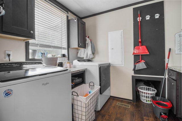 6989 W Laurel Rd, London, KY 40741 - clothes washing area featuring washer and clothes dryer, electric panel, cabinet space, dark wood-type flooring, and visible vents