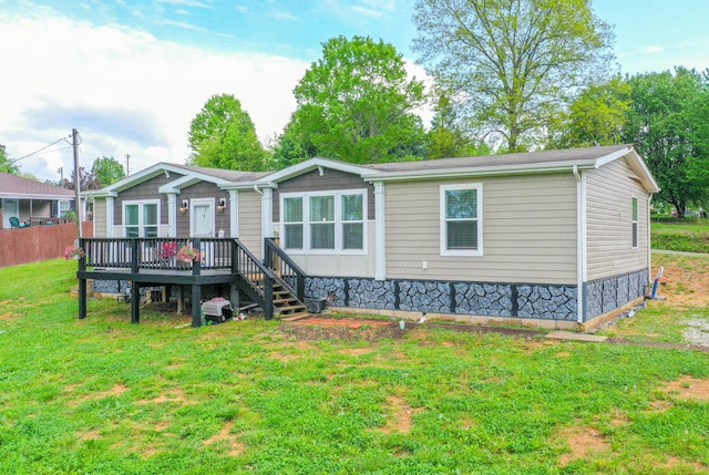 6989 W Laurel Rd, London, KY 40741 - back of house with a yard, a wooden deck, and fence
