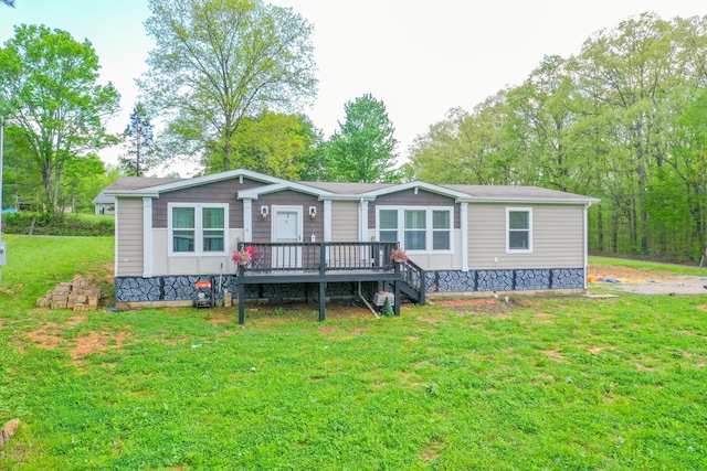 6989 W Laurel Rd, London, KY 40741 - manufactured / mobile home featuring a front lawn and a deck