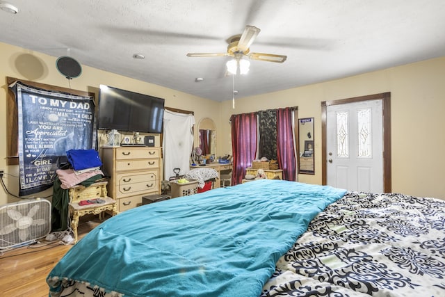 bedroom with ceiling fan and wood finished floors
