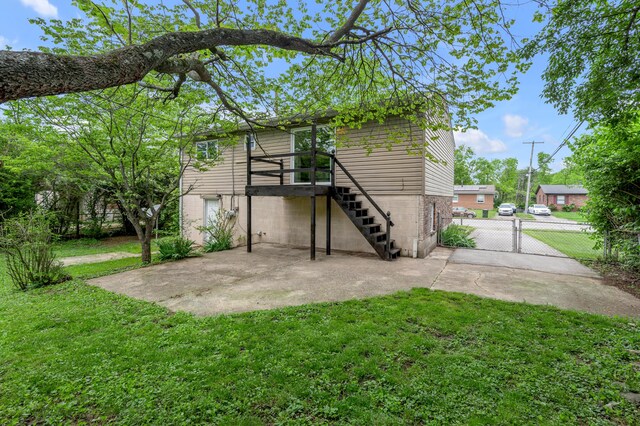 rear view of house with a patio and stairs