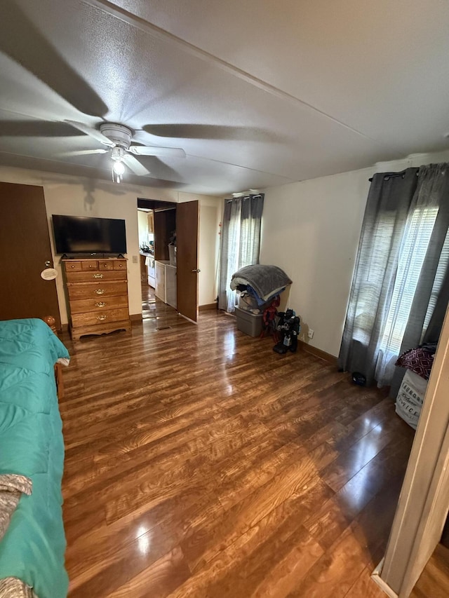 unfurnished bedroom with baseboards and wood finished floors