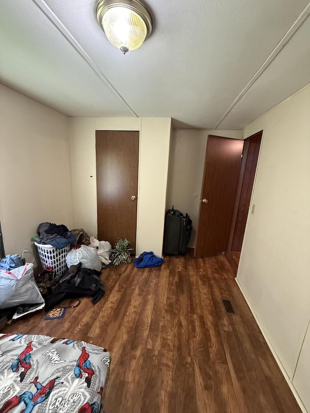 bedroom featuring wood finished floors