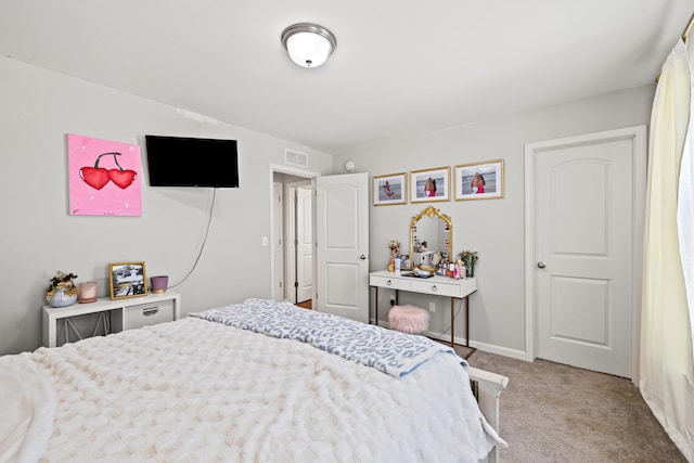 bedroom featuring light colored carpet, baseboards, and visible vents
