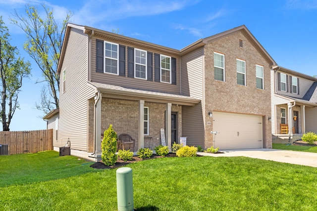 traditional-style house with a garage, a front lawn, fence, brick siding, and concrete driveway