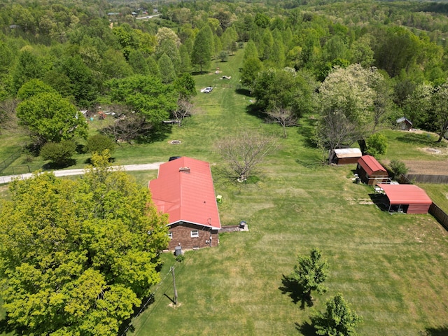 birds eye view of property with a wooded view