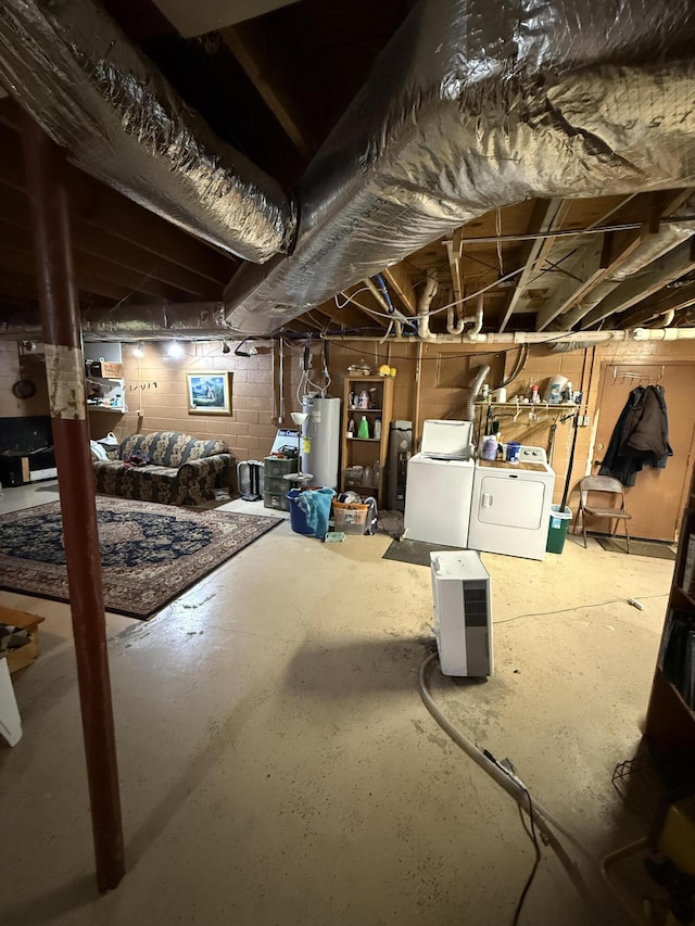 unfinished below grade area featuring separate washer and dryer and water heater