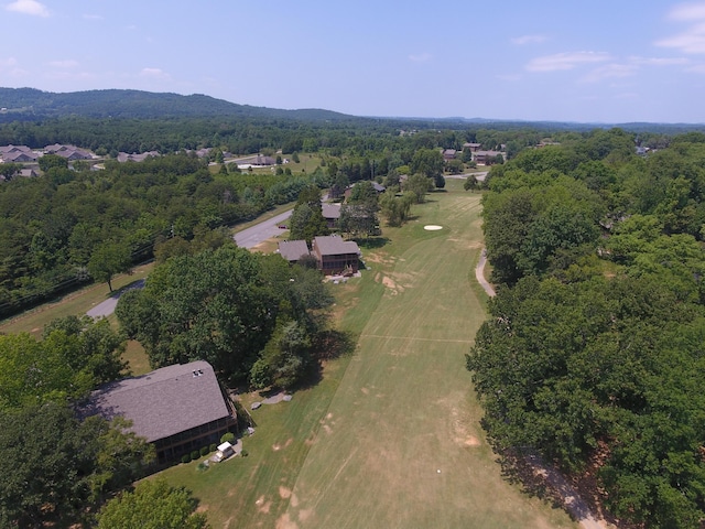 drone / aerial view with a wooded view