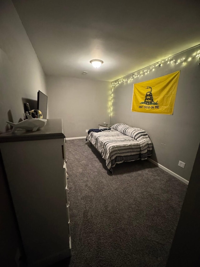 carpeted bedroom featuring baseboards