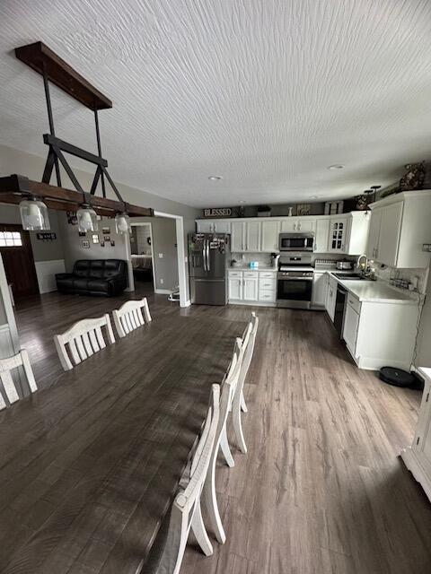 171 Elm Loop, Hustonville, KY 40437 - dining room featuring dark wood-type flooring