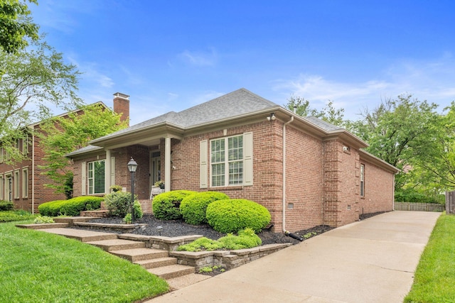 3283 Snaffle Rd, Lexington, KY 40513 - view of front facade featuring brick siding, a chimney, and a shingled roof