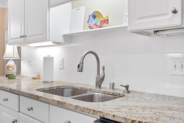 3283 Snaffle Rd, Lexington, KY 40513 - kitchen with a sink, white cabinets, backsplash, and light stone countertops