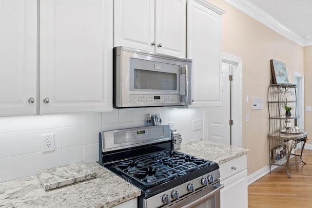 3283 Snaffle Rd, Lexington, KY 40513 - kitchen featuring stainless steel appliances, ornamental molding, white cabinetry, tasteful backsplash, and light wood finished floors