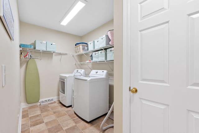 3283 Snaffle Rd, Lexington, KY 40513 - clothes washing area with washing machine and clothes dryer and baseboards