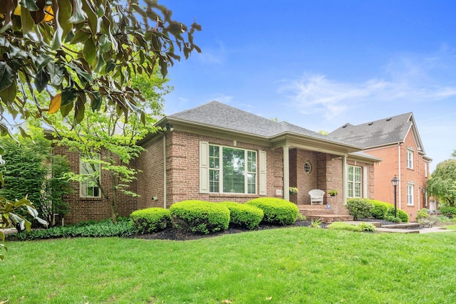 3283 Snaffle Rd, Lexington, KY 40513 - view of front facade featuring brick siding and a front lawn
