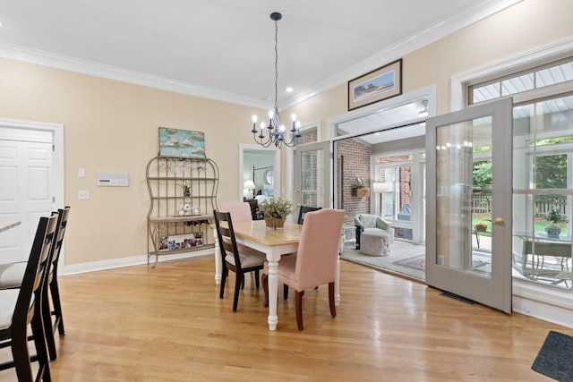 3283 Snaffle Rd, Lexington, KY 40513 - dining room with a chandelier, crown molding, light wood-type flooring, and baseboards