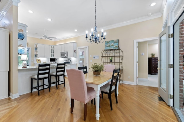 3283 Snaffle Rd, Lexington, KY 40513 - dining space with crown molding, ceiling fan, light wood-style flooring, recessed lighting, and a chandelier
