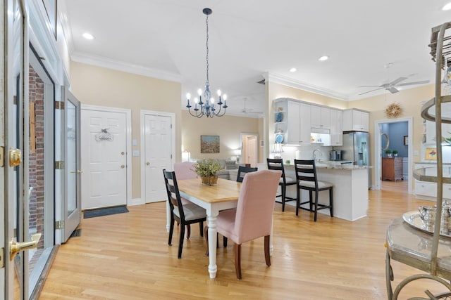 3283 Snaffle Rd, Lexington, KY 40513 - dining room with crown molding, a ceiling fan, light wood-type flooring, a chandelier, and recessed lighting