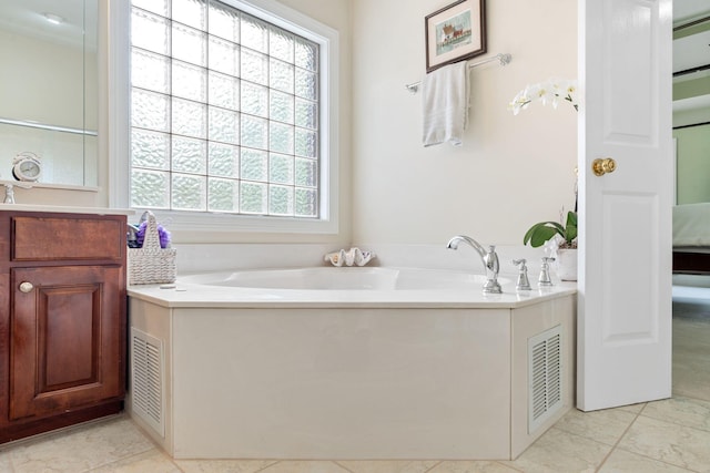 3283 Snaffle Rd, Lexington, KY 40513 - ensuite bathroom with tile patterned floors, a garden tub, and vanity
