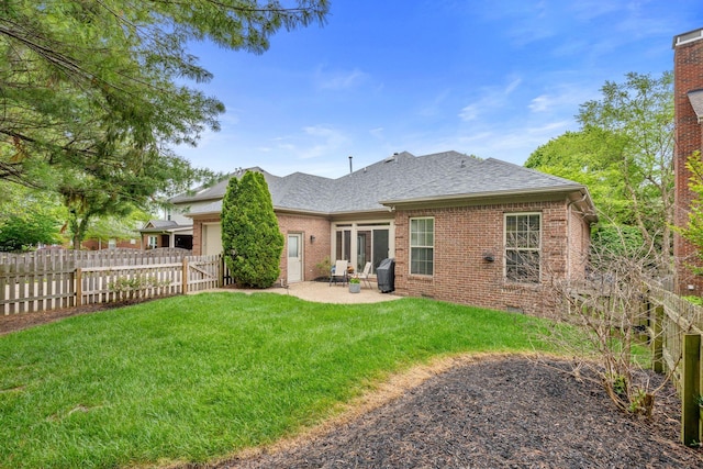 3283 Snaffle Rd, Lexington, KY 40513 - rear view of property featuring a patio area, a shingled roof, brick siding, and an attached garage
