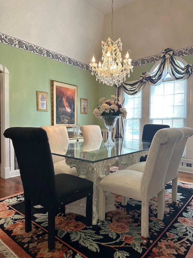 101 Wildwood Dr, Somerset, KY 42503 - dining room featuring high vaulted ceiling, baseboards, wood finished floors, and a notable chandelier