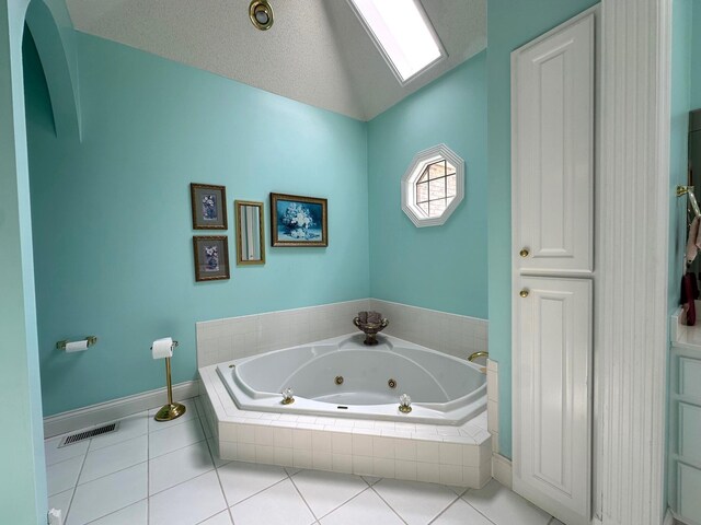 101 Wildwood Dr, Somerset, KY 42503 - full bath featuring tile patterned flooring, a jetted tub, baseboards, lofted ceiling, and visible vents