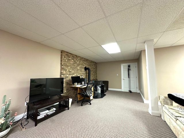 101 Wildwood Dr, Somerset, KY 42503 - interior space featuring carpet floors, a wood stove, baseboards, and a paneled ceiling