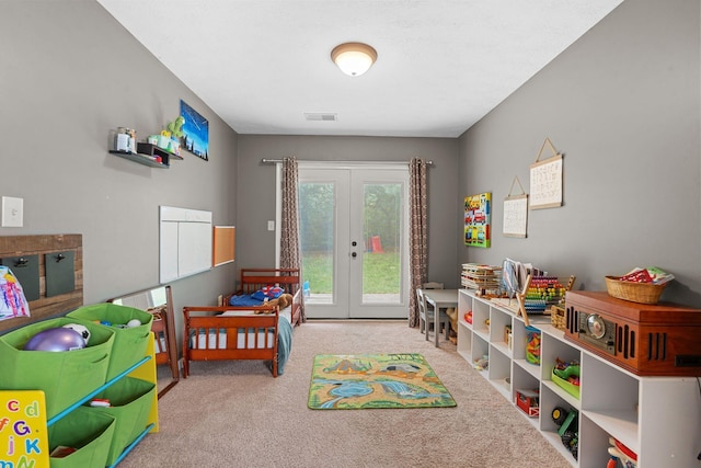 rec room featuring french doors, carpet flooring, and visible vents