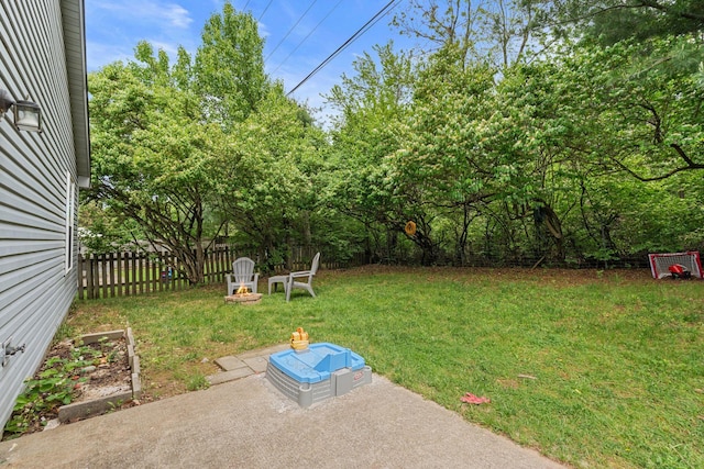 view of yard with fence and a patio