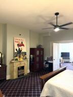 519 Ann St, Frankfort, KY 40601 - bedroom with dark colored carpet and a fireplace