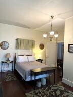 519 Ann St, Frankfort, KY 40601 - bedroom with an inviting chandelier and baseboards