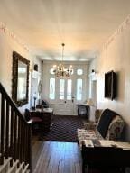 519 Ann St, Frankfort, KY 40601 - living room with hardwood / wood-style floors, an inviting chandelier, and stairway