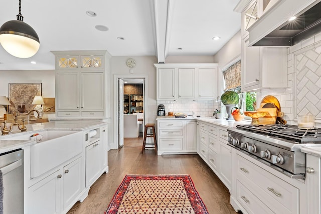 kitchen featuring wood finished floors, premium range hood, beamed ceiling, stainless steel appliances, and white cabinetry