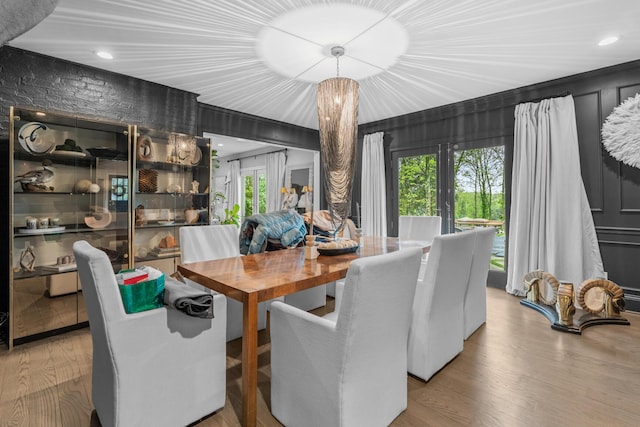 dining space featuring recessed lighting and wood finished floors
