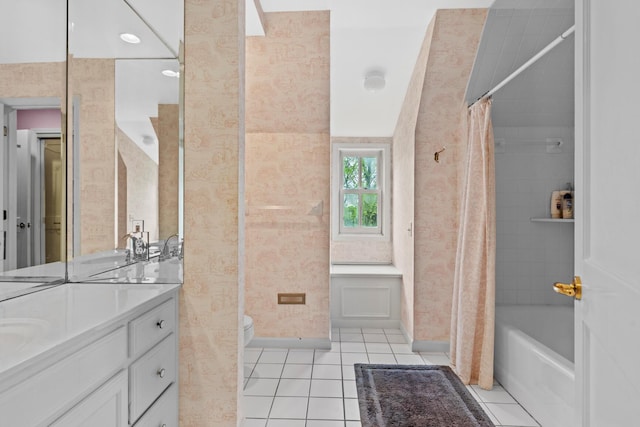 bathroom with vanity, tile patterned flooring, shower / bath combo with shower curtain, and toilet
